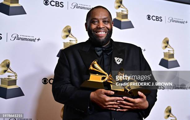 Rapper Killer Mike poses in the press room with the Grammy for Best Rap Performance, Best Rap Album and Best Rap Song during the 66th Annual Grammy...