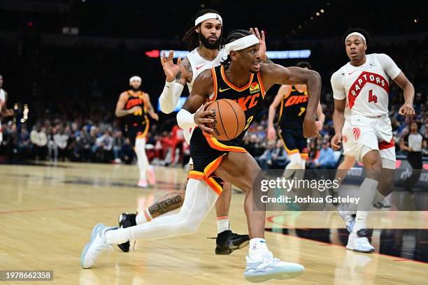 Shai Gilgeous-Alexander of the Oklahoma City Thunder drives the ball during the second half against the Toronto Raptors at Paycom Center on February...