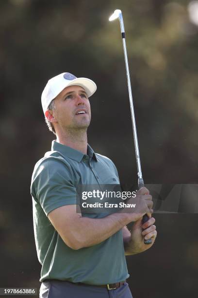 Former MLB player Buster Posey plays a shot on the 12th hole during the first round of the AT&T Pebble Beach Pro-Am at Spyglass Hill Golf Course on...