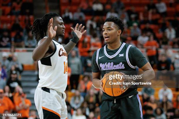 Kansas State Wildcats guard Tylor Perry looks to pass around Oklahoma State Cowboys guard Jamyron Keller on February 3rd, 2024 at Gallagher-Iba Arena...
