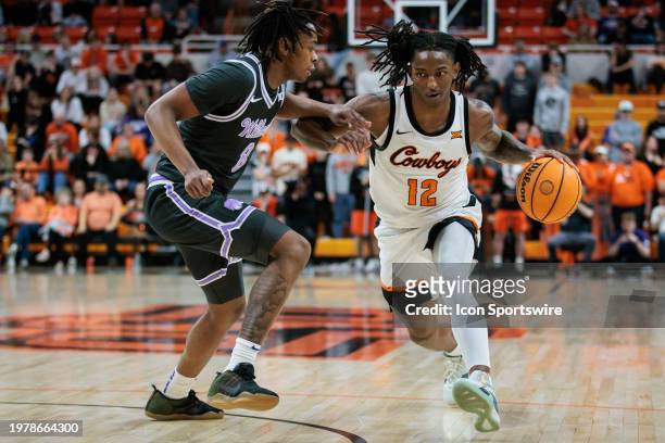 Oklahoma State Cowboys guard Javon Small drives around Kansas State Wildcats guard R.J. Jones on February 3rd, 2024 at Gallagher-Iba Arena in...