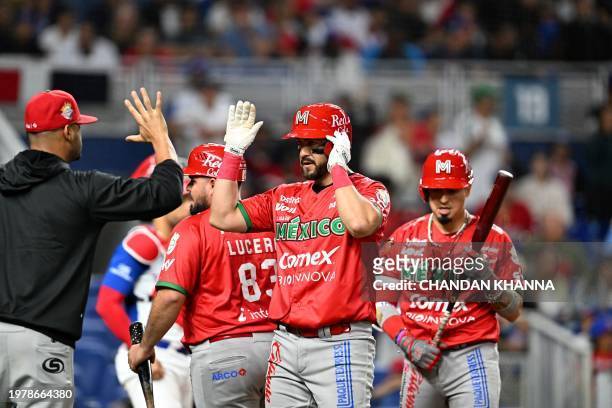 Mexico's infielder Agustin Murillo Pineda celebrates after hitting a homerun during the Caribbean Series baseball game between Mexico and the...