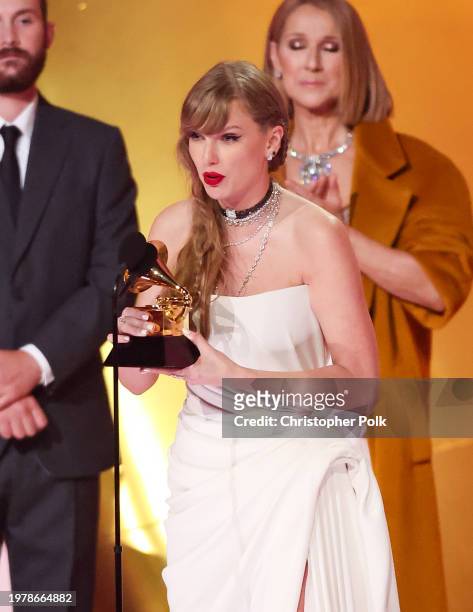 Taylor Swift accepts the Album Of The Year award for "Midnights" on stage with Celine Dion at the 66th Annual GRAMMY Awards held at Crypto.com Arena...