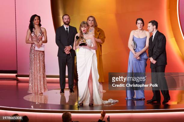 Taylor Swift accepts the Album Of The Year award for "Midnights" on stage with Celine Dion and Jack Antonoff at the 66th Annual GRAMMY Awards held at...
