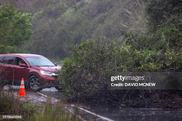 Driver is turned back by a mud slide blocking the road as the second and more powerful of two atmospheric river storms, and potentially the biggest...