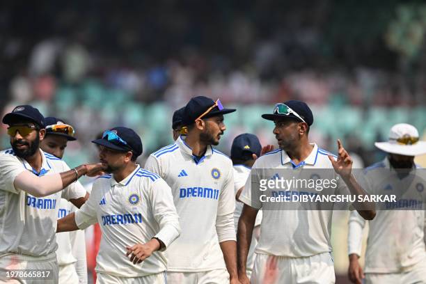 India's Jasprit Bumrah, Kuldeep Yadav, Axar Patel and Ravichandran Ashwin speak as they leave the ground for the lunch break during the fourth day of...