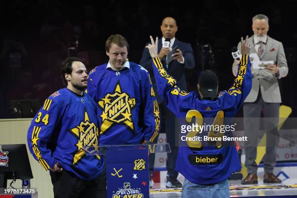 Auston Matthews and Morgan Rielly of the Toronto Maple Leafs greet Singer Justin Bieber prior to the draft during 2024 NHL All-Star Thursday at...