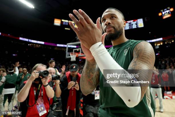 Damian Lillard of the Milwaukee Bucks acknowledges the crowd during his return against the Portland Trail Blazers at Moda Center on January 31, 2024...