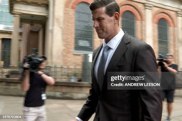 This video grab taken from AFPTV shows former member of Australia's elite Special Air Service regiment Ben Roberts-Smith leaving the Federal Court in...