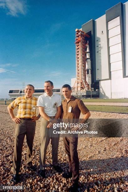 The crew of Apollo 8 stand in front of the Saturn 5 rocket as it heads to the launch pad on October 9, 1968 in Cape Canaveral, Florida.