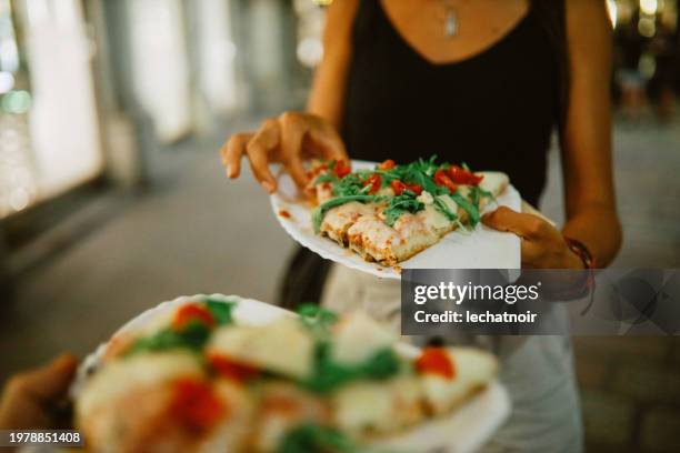 pizza cut on the go in milano - milan stock pictures, royalty-free photos & images