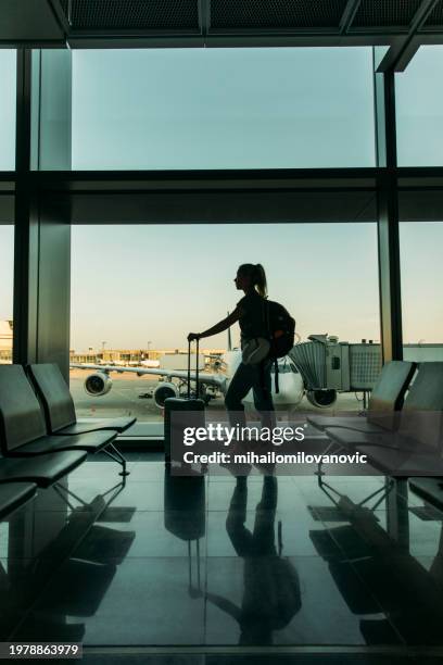 at the airport - airport departure area stock pictures, royalty-free photos & images