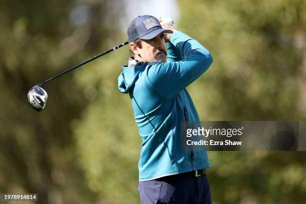Aaron Rodgers of the NFL New York Jets plays his shot from the 13th tee during the first round of the AT&T Pebble Beach Pro-Am at Spyglass Hill Golf...