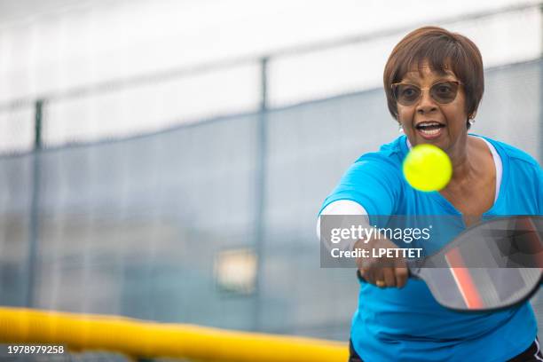 pickleball seniors - female exercising stock pictures, royalty-free photos & images