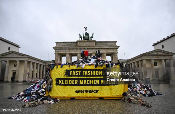 View of the textile waste as a group of environmental activists of Greenpeace, an independent global campaigning network, bring textile waste...