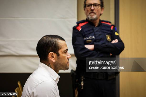 Brazilian footballer Dani Alves looks on at the start of his trial at the High Court of Justice of Catalonia in Barcelona, on February 5, 2024....