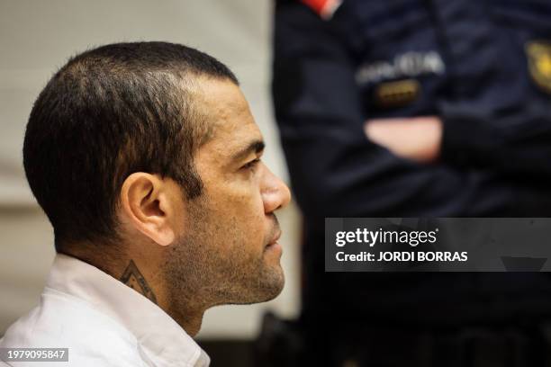 Brazilian footballer Dani Alves looks on at the start of his trial at the High Court of Justice of Catalonia in Barcelona, on February 5, 2024....