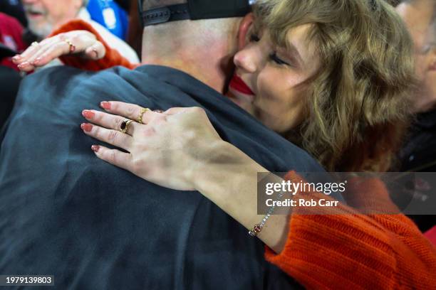 Detailed view of Taylor Swift's hand as she hugs Travis Kelce of the Kansas City Chiefs after a 17-10 victory against the Baltimore Ravens in the AFC...