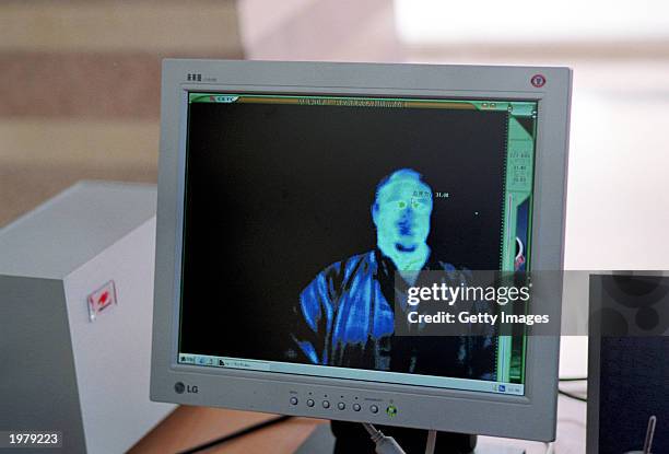 The body temperature of an unidentified person is shown on a computer screen that connects to a thermal imagery camera at a facility near the newly...