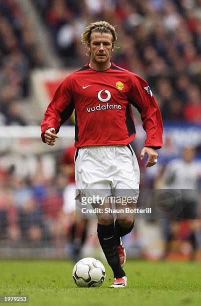David Beckham of Manchester United runs with the ball during the FA Barclaycard Premiership match between Manchester United and Charlton Athletic...