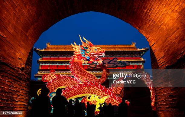Fancy lanterns and light installations illuminate the City Walls during a rehearsal of the Spring Festival Light Show on February 1, 2024 in Xi'an,...