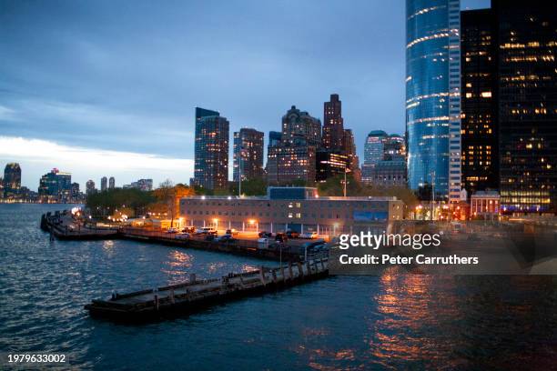 lower manhattan skyline at dusk - new york harbour stock pictures, royalty-free photos & images
