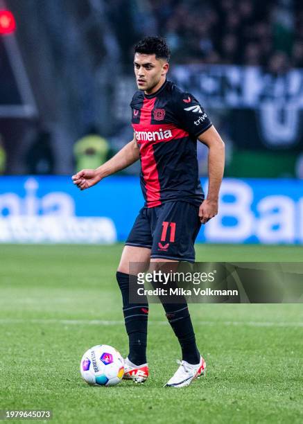 Nadiem Amiri of Leverkusen runs with the ball during the Bundesliga match between Bayer 04 Leverkusen and Borussia Moenchengladbach at BayArena on...