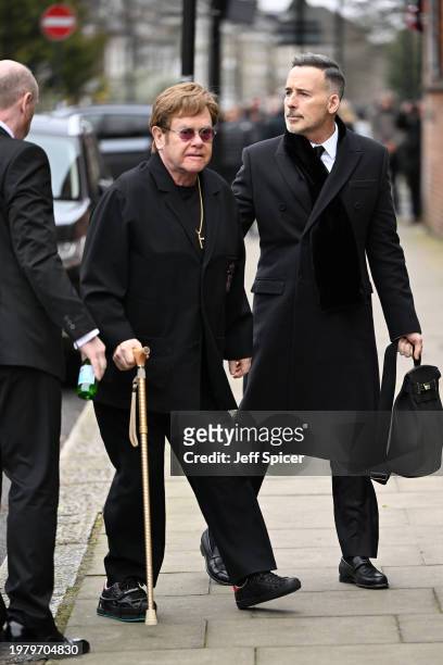 Elton John and David Furnish attend the funeral of Derek Draper at St Mary the Virgin Church, on February 02, 2024 in London, England.