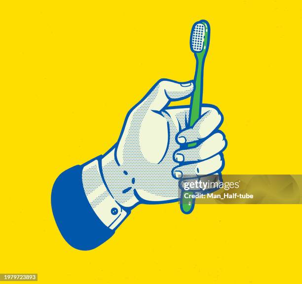 hand with toothbrush - toothbrush stock illustrations
