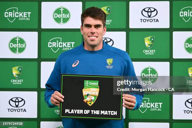 Xavier Bartlett of Australia poses with the player of the match certificate following game one of the One Day International series between Australia...