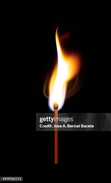 flame from a wooden match on a black background. - allumette bâton photos et images de collection