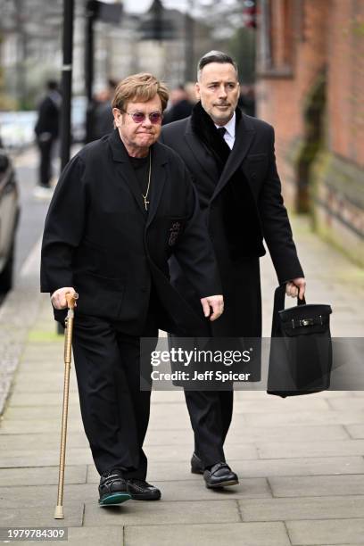 Elton John and David Furnish attend the funeral of Derek Draper at St Mary the Virgin Church, on February 02, 2024 in London, England.