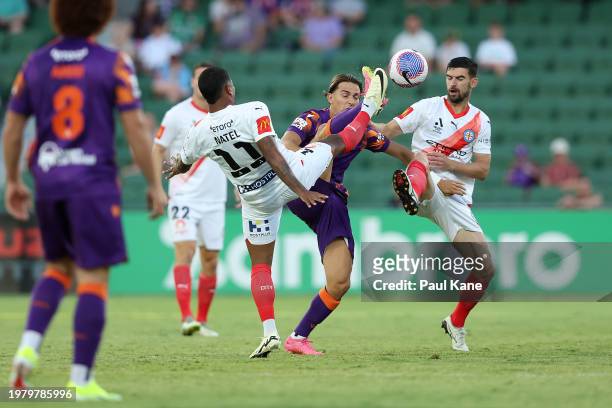 Giordano Colli of the Glory contest for the ball against Leo Natel and Steven Ugarkovic of Melbourne City during the A-League Men round 15 match...