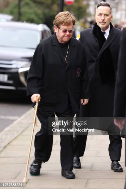 Elton John and David Furnish attend the funeral of Derek Draper at St Mary the Virgin Church, on February 02, 2024 in London, England.