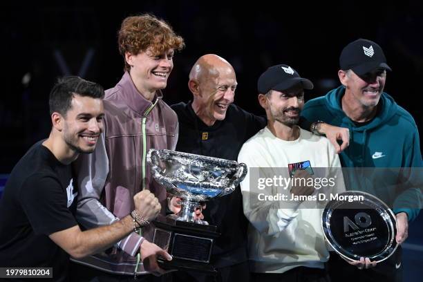 Jannik Sinner of Italy poses with his team and with the Norman Brookes Challenge Cup after winning the 2024 Australian Open Final on January 29, 2024...