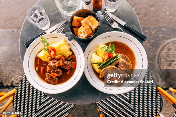lamb and beef served with mashed potatoes for lunch at french bistro in paris, france - comida francesa fotografías e imágenes de stock