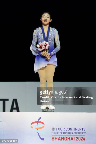 Gold medalists Mone Chiba of Japan pose at the medal ceremony for the Women's Free Skating during day two of the ISU Four Continents Figure Skating...