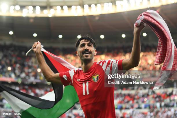 Yazan Al Naimat of Jordan celebrates victory in the AFC Asian Cup quarter final match between Tajikistan and Jordan at Ahmad Bin Ali Stadium on...