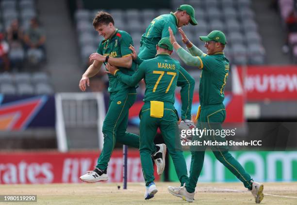 Riley Norton of South Africa celebrates with teammates after taking the wicket of Vishwa Lahiru of Sri Lanka during the ICC U19 Men's Cricket World...