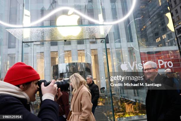 Apple CEO Tim Cook arrives as people stand in line to purchase the Apple Vision Pro headset at the Fifth Avenue Apple store on February 02, 2024 in...