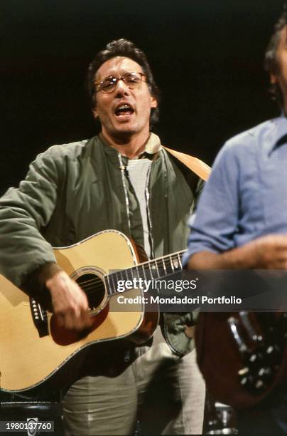 Singer-songwriter, cabaret artist, pianist, actor, screenwriter Enzo Jannacci during a concert. 1980