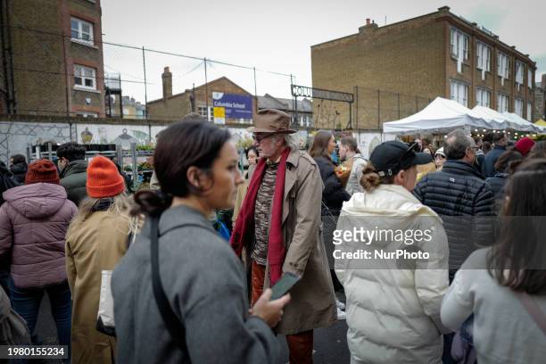 People are attending the Columbia Road flower market in East London, on February 4, 2024.