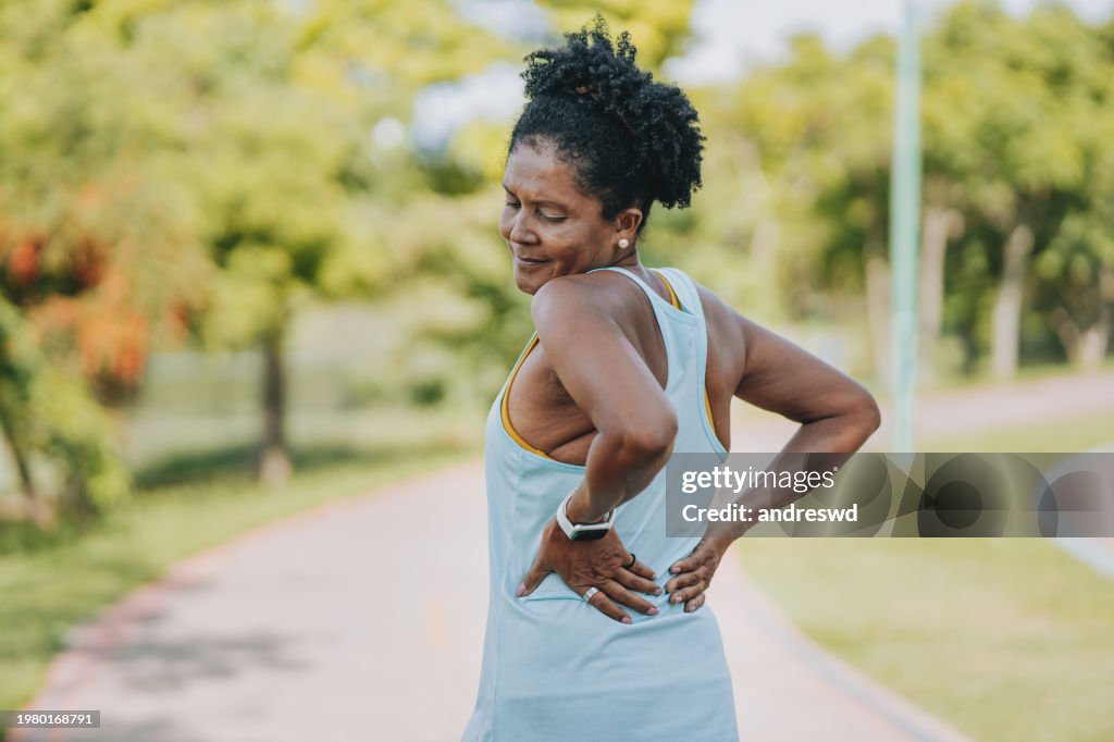 Portrait of a mature woman with back pain