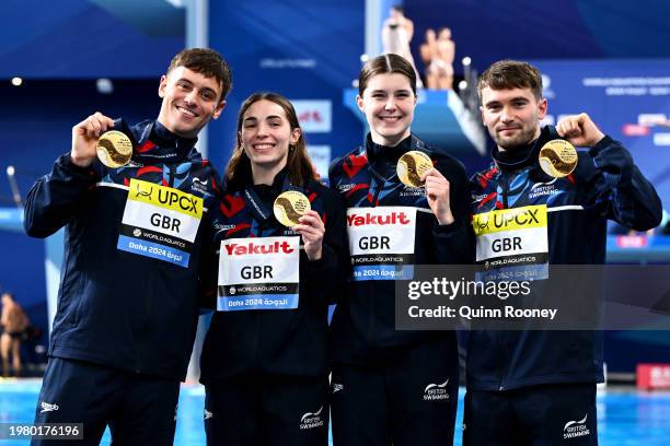 Gold Medalists, Daniel Goodfellow, Thomas Daley, Scarlett Mew Jensen and Andrea Spendolini Sirieix of Team Great Britain pose with their medals...
