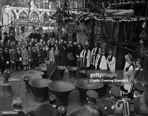 High-angle view of the dedication ceremony for the eleven new bells and the restored Sanctus bell, held outside the west doors of St Clement Danes...