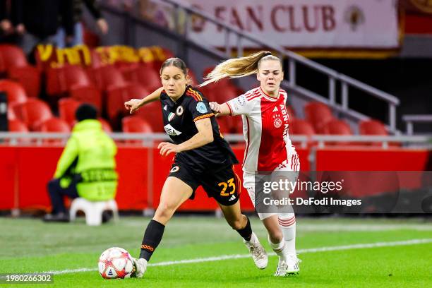 Laura Feiersinger of AS Roma and Milicia Keijzer of AFC Ajax battle for the ball during the UEFA Women's Champions League group stage match between...