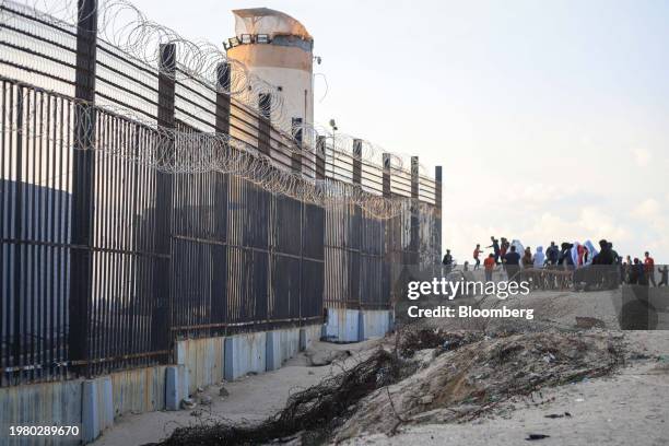 Displaced Palestinians beside the border wall with Egypt in Rafah, Gaza Strip, on Thursday. Feb. 1, 2024. Negotiations are advancing for an agreement...