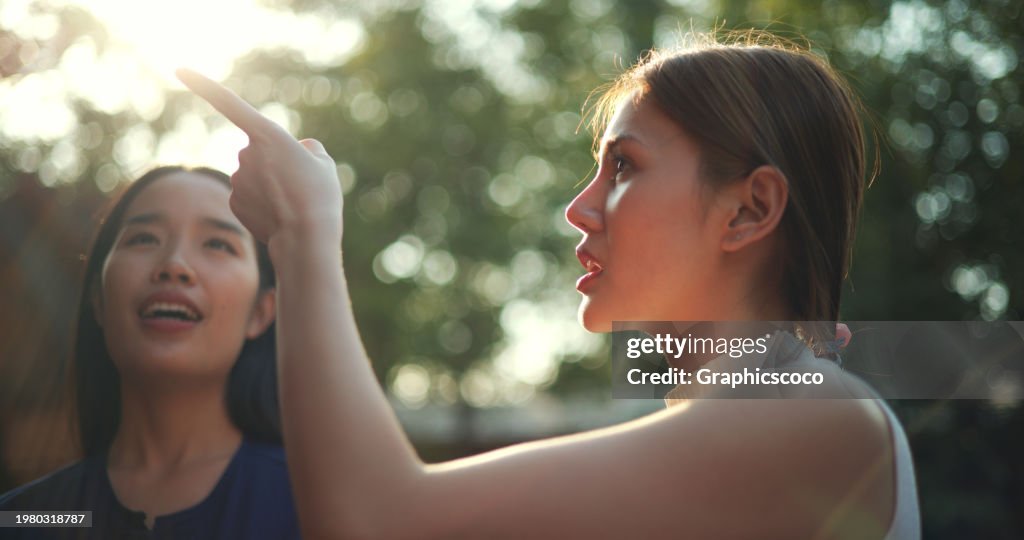 Smiling Local Guide Young Female Local Guide Takes Young Tourist To Visit Ancient ...