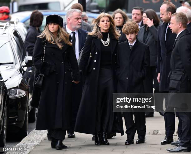 Darcey Draper, Kate Garraway and Billy Draper attend the funeral of Derek Draper at St Mary the Virgin Church, on February 02, 2024 in London,...