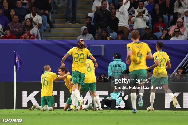 Craig Goodwin of Australia celebrates his opening goal during the AFC Asian Cup quarter final match between Australia and South Korea at Al Janoub...